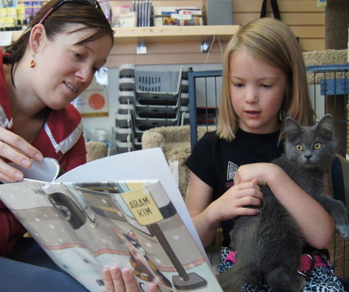Happy family and kitten at Purr Me a Story